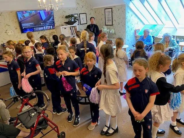 Talbot Heath School bringing joy to residents of Kingsman House