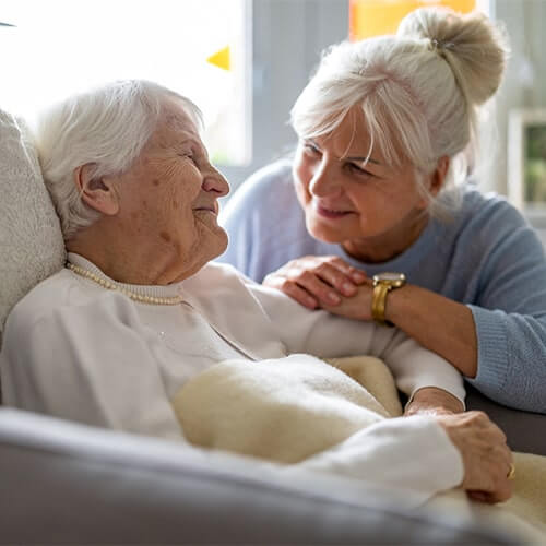 elderly woman with her caregiver